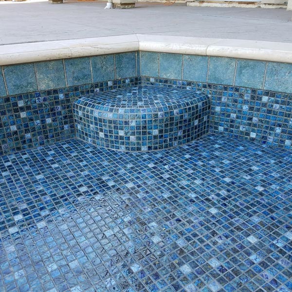 blue tile floor in pool